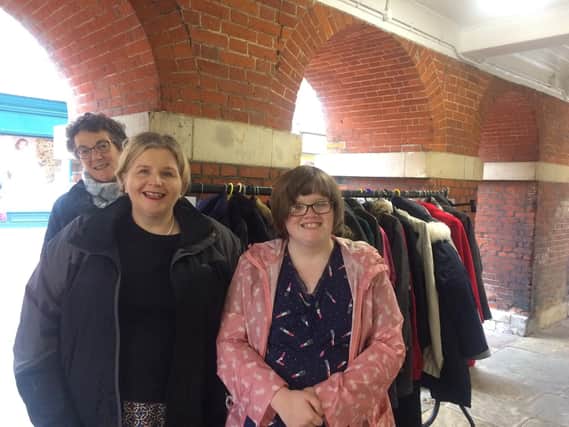 Chichester Community Coat Rack launch 2018. Four Streets Project Fiona Bell with Donna Ockenden and her daughter Phoebe.