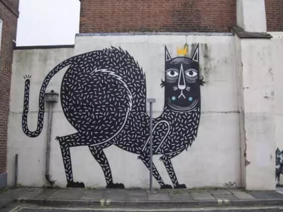 The 'King of Cats' created by Belgian artists Joachim, next to JPS' 'Big Deal' behind Superdrug in East Street