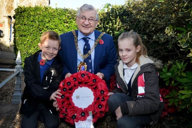 Pupils at Ore Village Primary Academy and Guestling Bradshaw Church of England Primary in Hastings have successfully helped to list their local war memorial.

Mayor Nigel Sinden with a pupils from Guestling Bradshaw Church of England Primary (left) and  Ore Village Primary Academy. SUS-180811-151719001