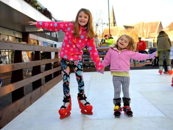 Children enjoying the ice rink at the Burgess Hill Christmas lights switch on event on Saturday (November 17). Photo by Steve Robards