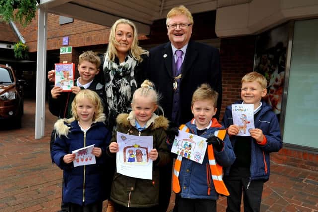 Haywards Heath mayor councillor Jim Knight with youngsters and their Christmas cards. Photo by Steve Robards