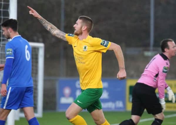 Two-goal Rob O'Toole celebrates against VCD Athletic on Saturday. Picture by John Lines