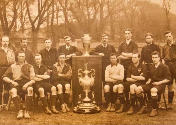 Eastbourne FC with the Eastbourne Charity Cup ("100 Guinea Cup") in 1910.