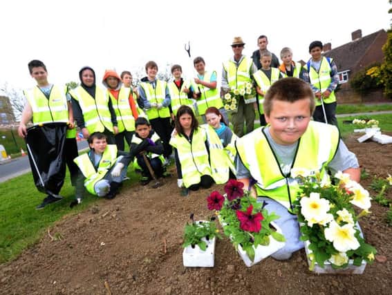 Ore in Bloom, one of the groups to benefit from the latest round of grants, planting and litter picking with pupils from Hastings Academy in 2013