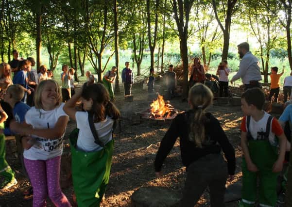 Bury CE Primary School pupils learning in the woods. The school received positive recognition following a recent Ofsted inspection SUS-181120-172059001