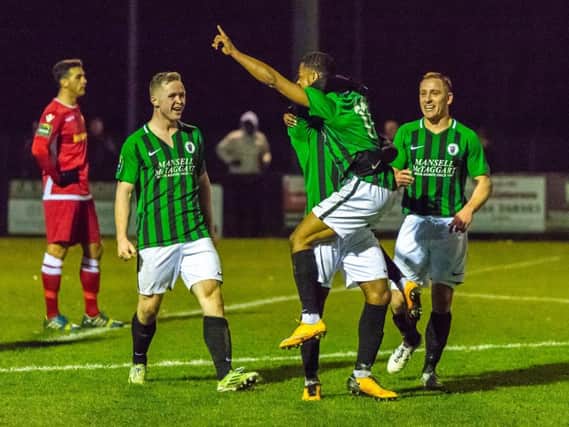 Debutant Keano Deacon (centre) bagged Burgess Hill Town's third in their 3-0 win over Merstham on Saturday. Picture by Chris Neal.