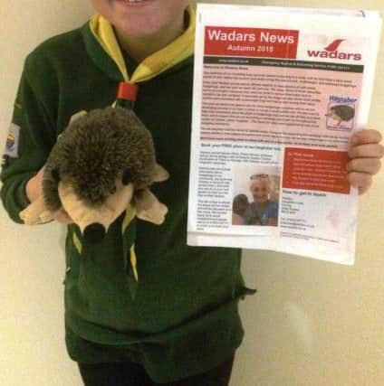 Ten-year-old Brooke Watts with her copy of Wadars News, as she continues her mission to help hedgehogs