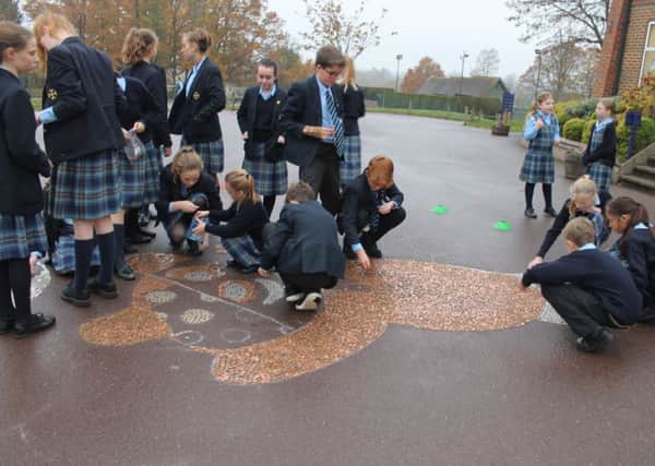 Cranleigh Prep pupils adding to the Pudsey artwork