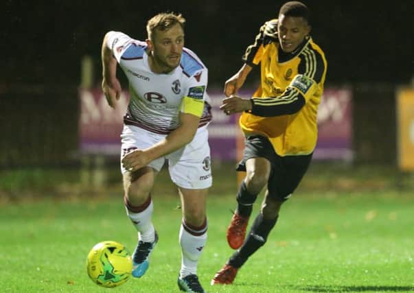 Hastings United captain Sam Adams on the ball during the Velocity Trophy defeat at home to Merstham on Tuesday night. Picture courtesy Scott White