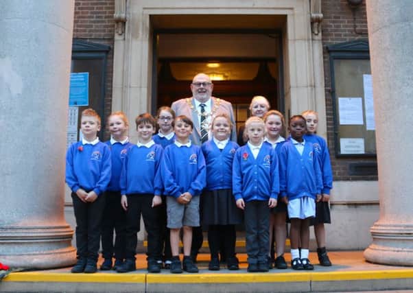 Pupils from Durrington Junior School presented their poppy artwork to Worthing's mayor Paul Baker