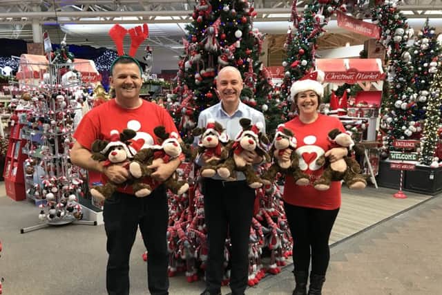 Nick Joad, manager at Haskins Roundstone Garden Centre, centre, with John Price, community and corporate fundraiser, and Kelly Newell, individual giving officer, at Love Your Hospital