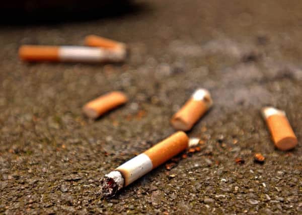 Undated handout photo of cigarette butts in the street. PRESS ASSOCIATION Photo. Issue date: Friday September 14, 2007. The number of cigarette butts dropped on the streets of England has gone up by more than 40% since the smoking ban was brought in, litter campaigners said today. Keep Britain Tidy said the English were much worse for dropping cigarette ends than the rest of the UK. See PA Story ENVIRONMENT Cigarettes. Photo credit should read: Ken Lennox/PA Wire pa_news_20050206_092001_environm