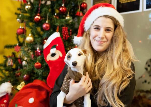 Chloe Clark with Rumba the pup reminds us dogs are welcome at the Christmas fair