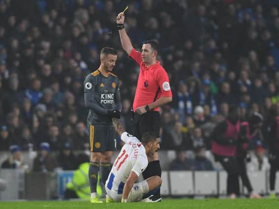 Leicester midfielder James Maddison is shown his first yellow card at the Amex. Picture by PW Sporting Photography