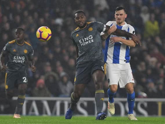Wes Morgan battles for the ball with Brighton midfielder Pascal Gross. Picture by PW Sporting Photography