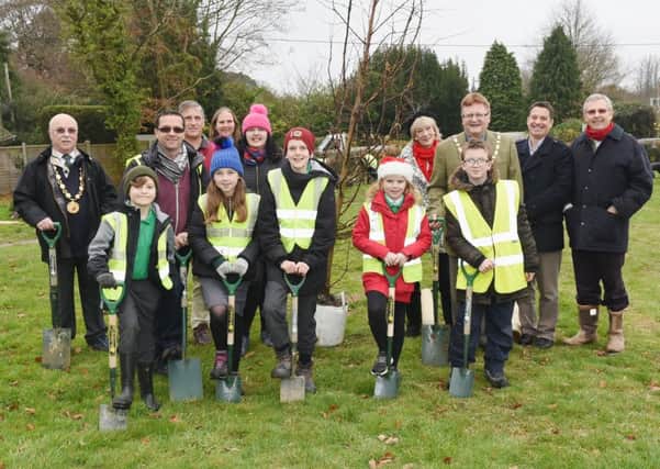 School children, college students and councilors come together at Beech Hurst Gardens to plant 26 trees to promote bigger tree planting project.