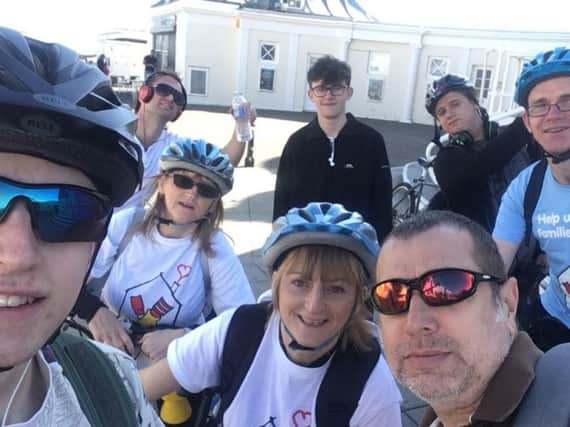 The bike ride team reach Worthing Pier