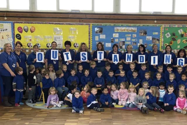 Staff and pupils at St Andrews Pre-School in Burgess Hill celebrating the outstanding Ofsted rating