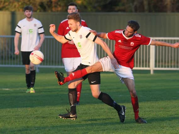 Alex Barbary (centre) was back among the goals as he hit two in Horsham YMCA's 5-3 win over Little Common on Saturday. Picture by Derek Martin.