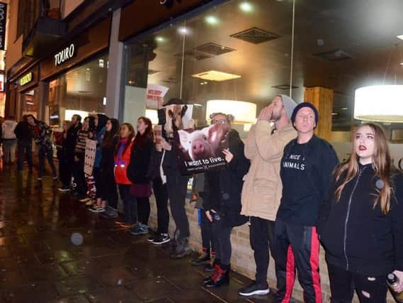 Animal rights activists outside Touro steakhouse in Brighton (Credit: DxE Brighton)