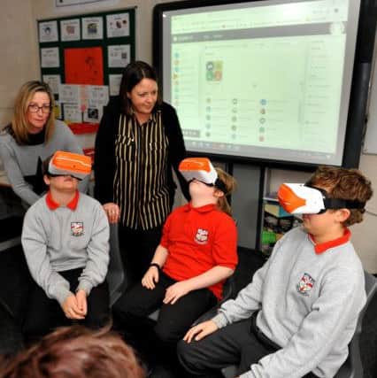 Pupils at Farney Close School using the virtual reality headsets. Photo by Steve Robards