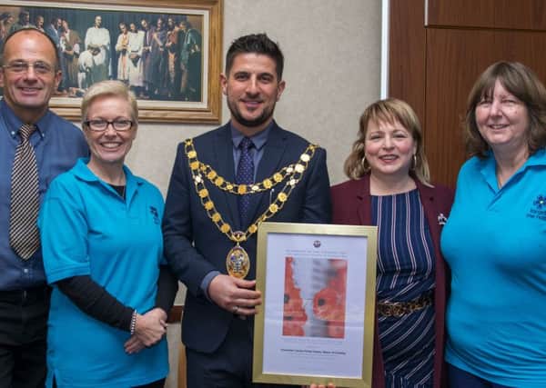 Crawley Mayor Councillor Castro and his wife with the local minister Jonathan Frost and the founder of the Forget Me Not Club founder Beverly Loxstonbown (second right) along with one of her volunteer colleagues