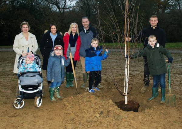 CALA Homes held a tree planting and time capsule burial event with the childrern who live on the development at Amlets Place in Cranleigh where it was held SUS-181128-130737001