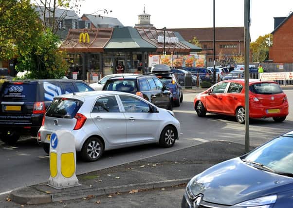 Traffic queueing to enter McDonalds drive thru Burgess Hill is causing problems on the roundabout just outside. Pic Steve Robards SR1829128 SUS-180311-162546001