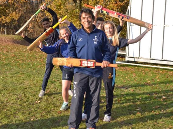 The founder of First Class Cricket Academy Raj Chaudhuri with pupils at Worth School, near Crawley.