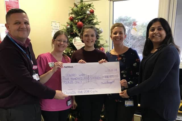 Presenting a cheque to the Howard Ward team