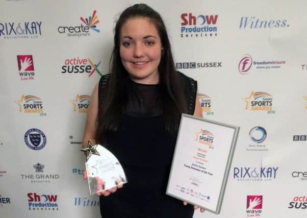 Bexhill College student Sarah Graham clutches her award