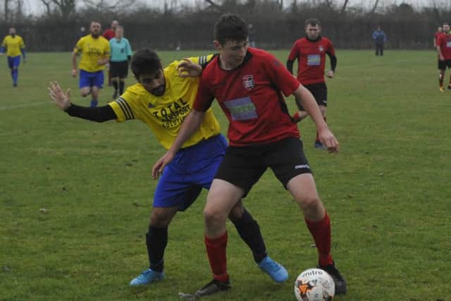 Rye Town and Hawkhurst United tussle for possession at Rye Rugby Club