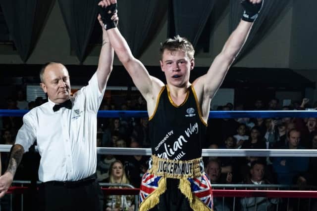 Alfie James raises his arms in victory at Bexhill Amateur Athletic Club on Saturday night. Picture courtesy Luke Jones, Bexhill Film Company