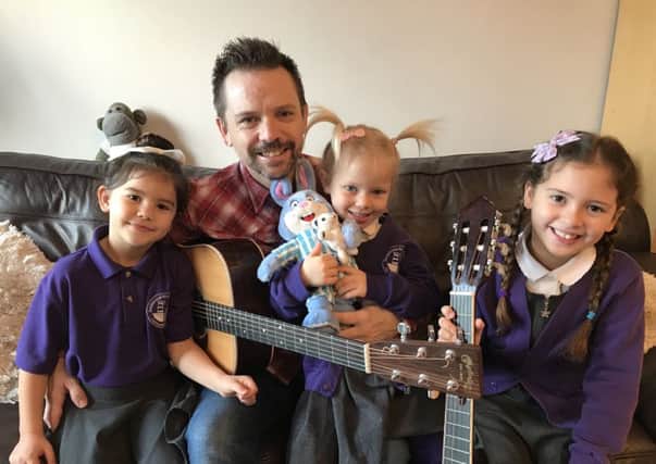 Tom Walker and his daughters who helped sing on his Christmas single