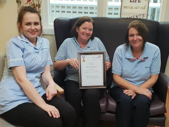 Staff at Elizabeth House with the award