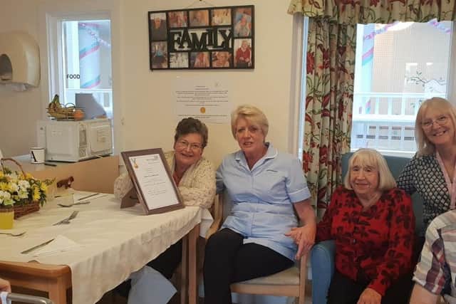 Staff and residents at Elizabeth House with the award