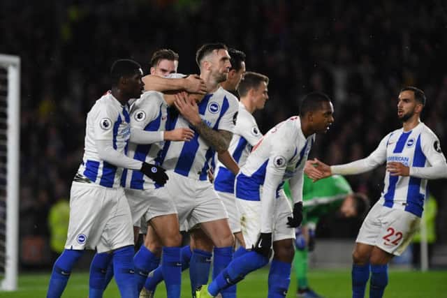 Glenn Murray is mobbed after putting Brighton & Hove Albion ahead from the penalty spot. Picture by PW Sporting Photography