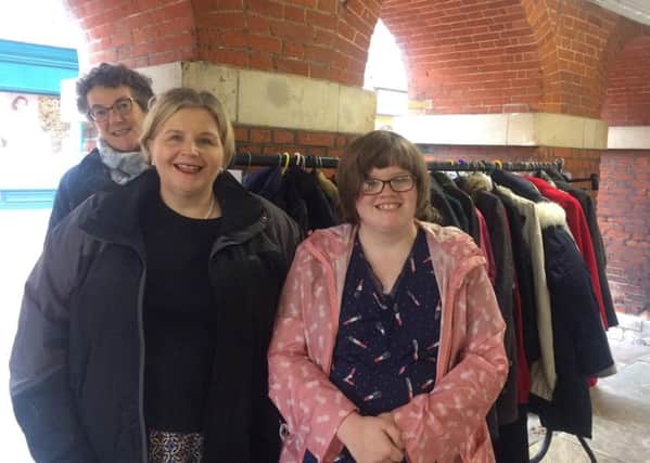 Chichester Community Coat Rack 2018. Volunteer Fiona Bell with Donna Ockenden and her daughter Phoebe.