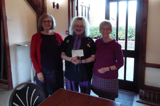 Anne Allen and Pam Taylor, organisers of the Slinfold Craft and Gift Fair, handing over the cheque to Heather Grahem, Together in Mind treasurer SUS-181012-112646001