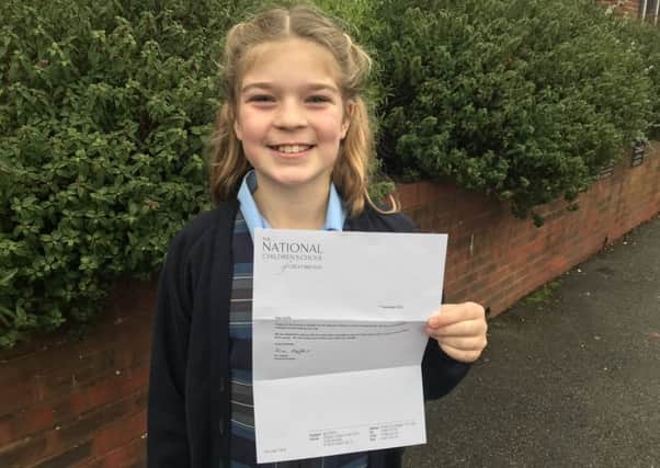 Cecilia Beddison with her letter from the National Childrens Choir