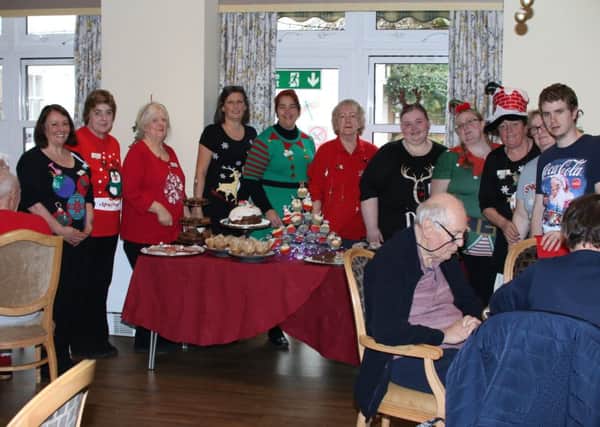 Red Oaks Care Home in Henfield marked Christmas Jumper Day by raising funds for Save the Children SUS-181219-125119001