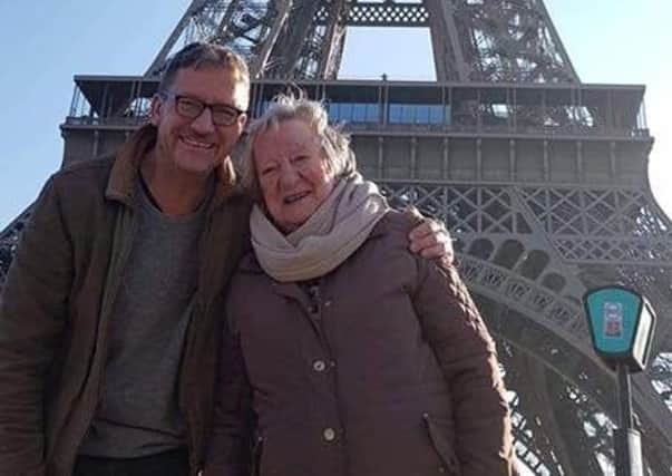 Rose Southon, who lives at Care UKs Skylark House in Horsham, visiting the Eiffel Tower in Paris with her son Nick SUS-181219-141315001