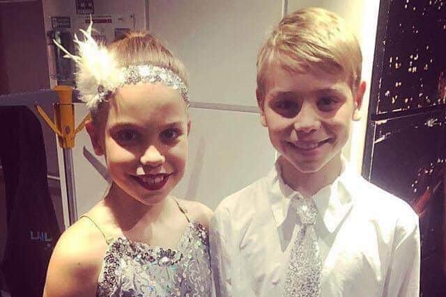 Two dancers set to go on stage for the New York, New York performance