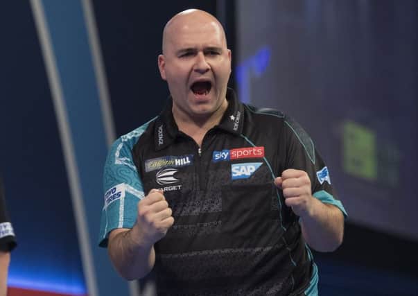 Rob Cross in celebratory mood during his victory over Jeffrey De Zwaan at the William Hill World Darts Championship last night. Picture courtesy Lawrence Lustig/PDC