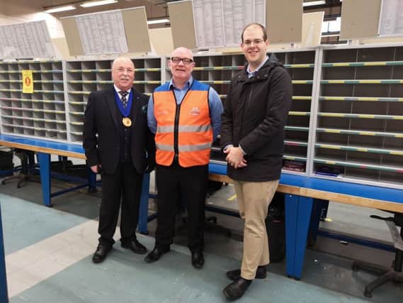 Cllr Bruce Forbes, Royal Mail manager Colin Lehane and Cllr Jonathan Ash-Edwards