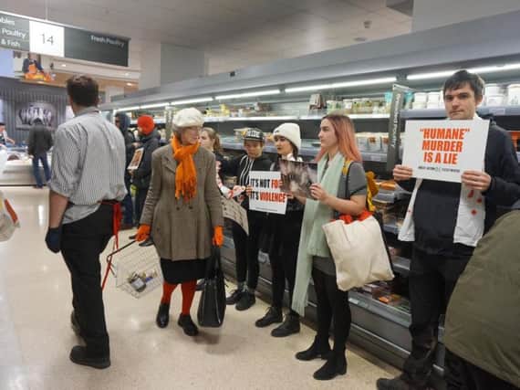 Vegan activists at the meat aisle in Waitrose, Brighton (Photographs: Direct Action Everywhere)