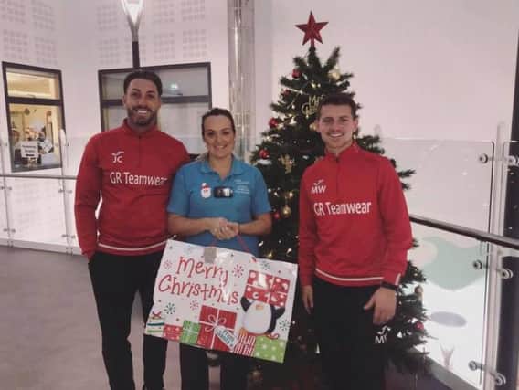 Jamie Crellin and Matt Whitehead deliver the Christmas presents