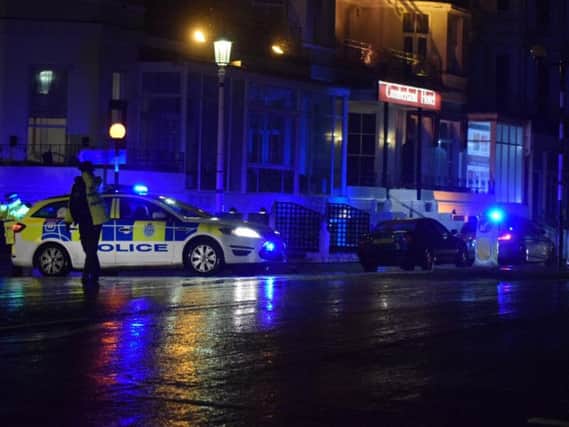 Police at the scene in Eastbourne's Grand Parade. Pic: Dan Jessup