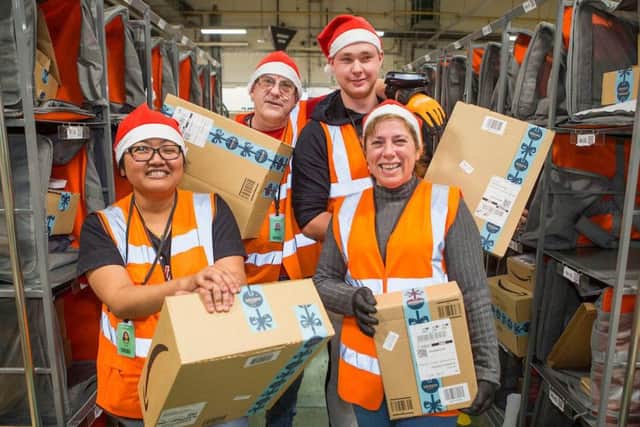 Staff at Amazon Littlehampton, from left, Wasiri Wolfe, Simon Tunney, Lee Francis and Cristina Felicio. Picture: David McHugh