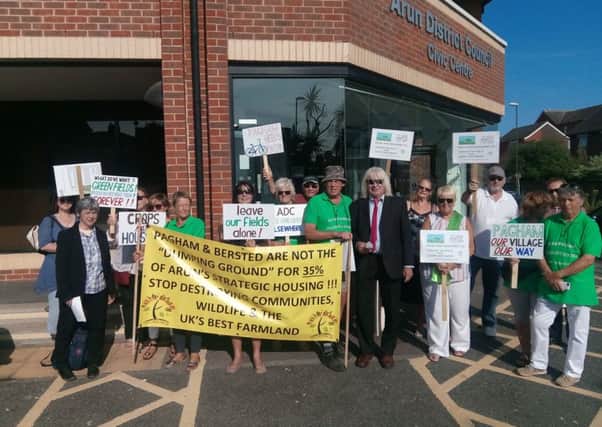 Residents outside the Arun District Council offices ahead of the meeting which saw the local plan adopted SUS-180719-094319001
